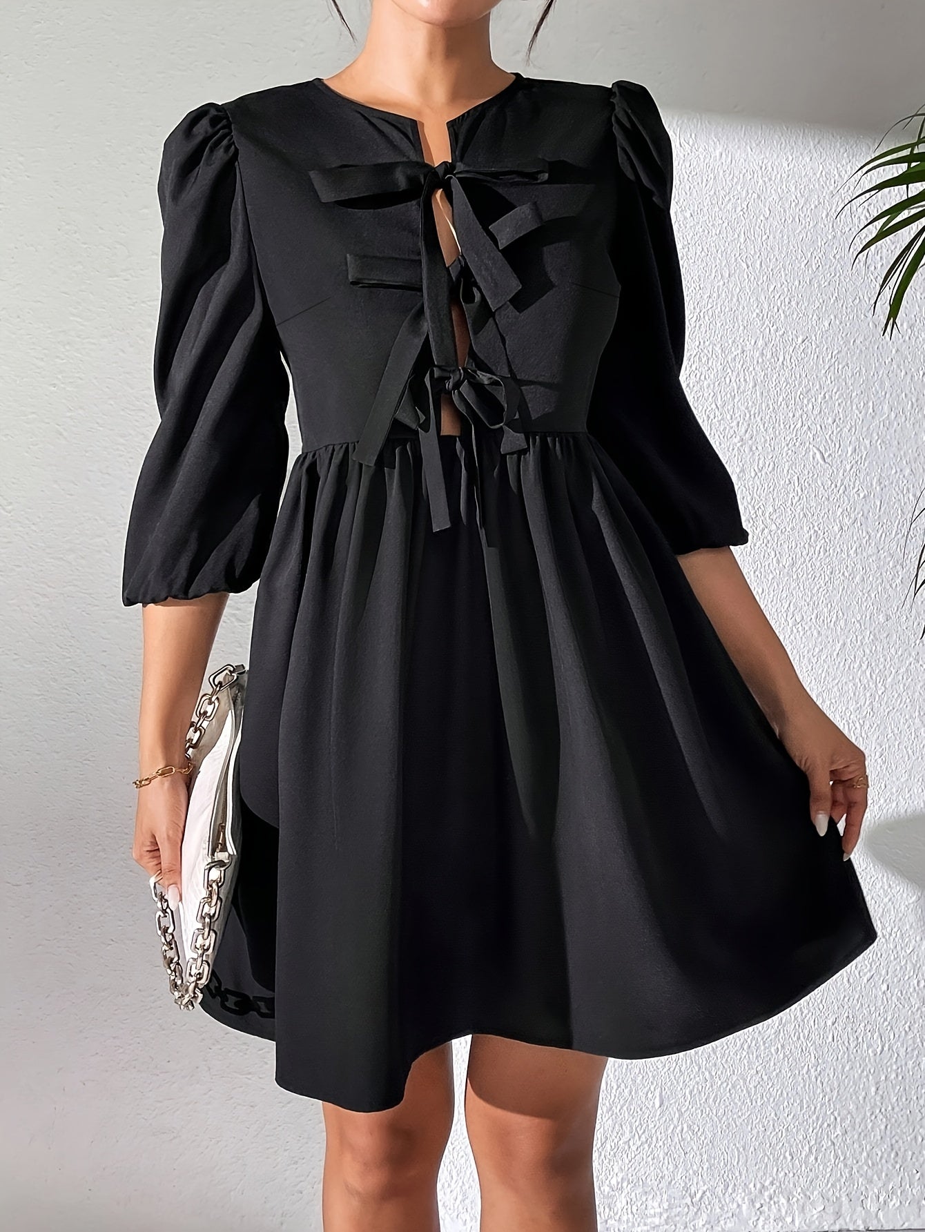 Zwarte jurk met strikdetail | Jurk | Chique zwarte jurk met opvallend strikdetail