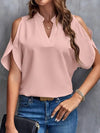 Kris - Effen blouse met inkepingen en eenvoudige elegante split mouwen - Visconte