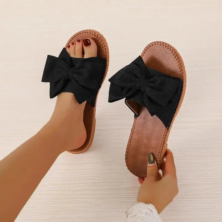 Mel - Comfortabele chique platte slippers met strikje - Visconte